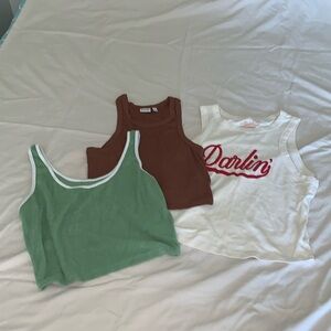 Three crop top tank tops